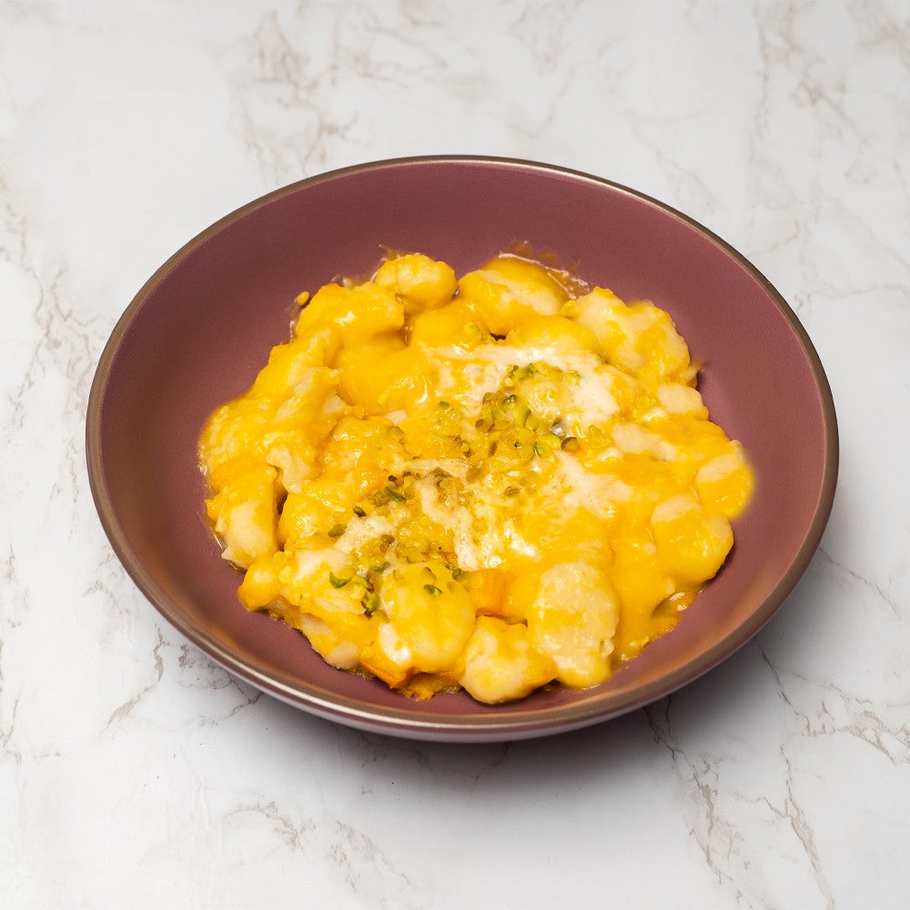 Gnocchi di patate alla crema di zucca, pecorino e granella di pistacchi